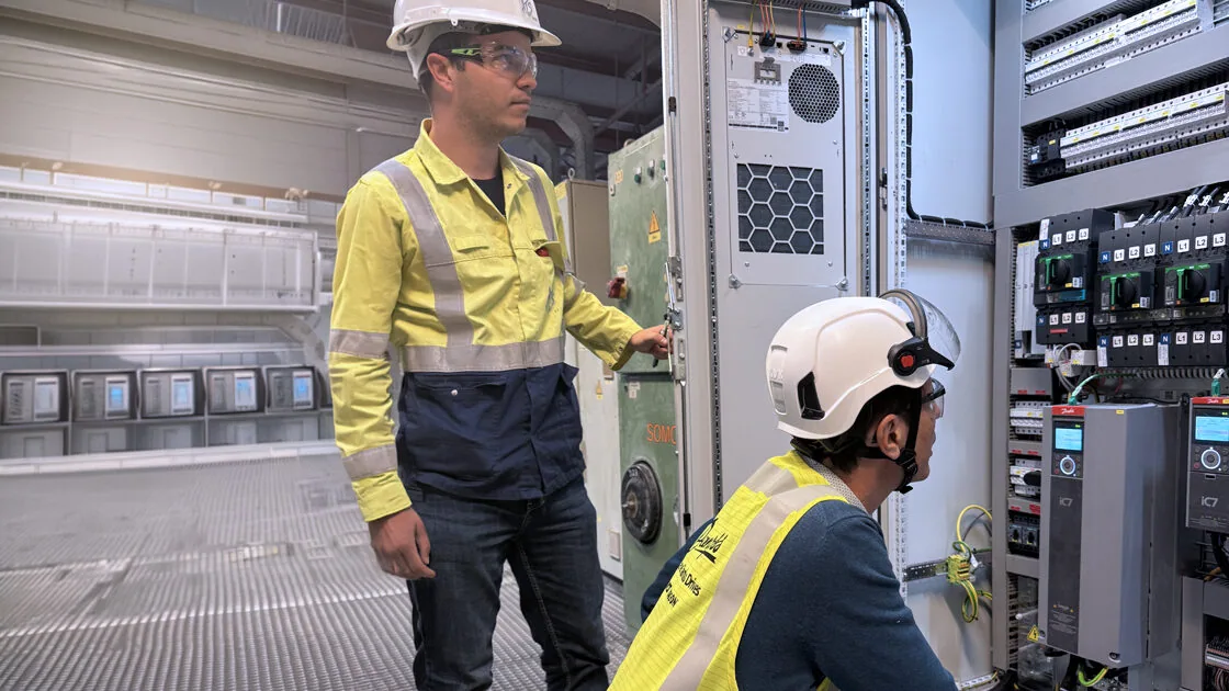 Technicians operating Danfoss iC7-Automation Drives available from Danfoss Authorised Partner LED Controls