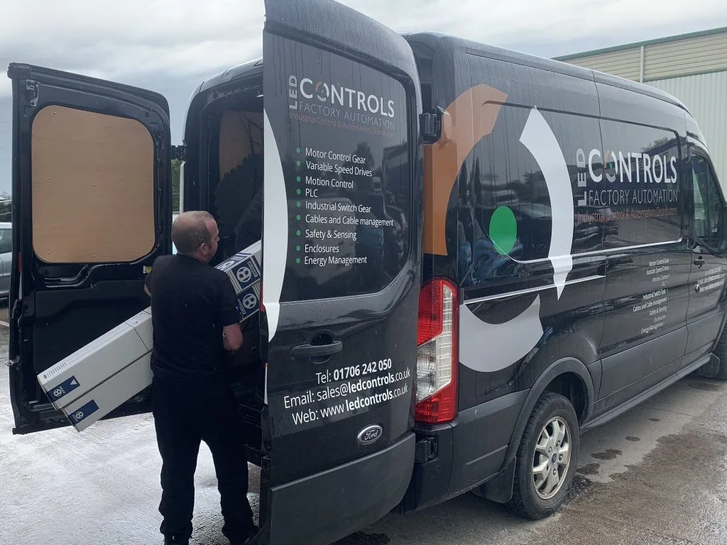 LED Controls shipping team loading a van.