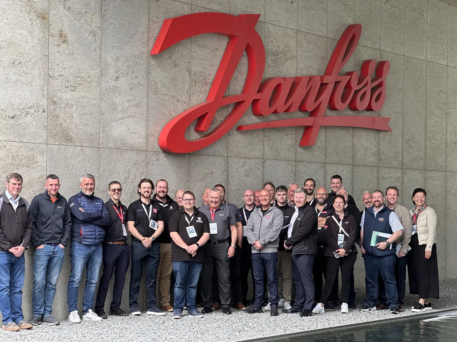 The UK attendees of Danfoss Drives Innovate gather outside the Danfoss building.