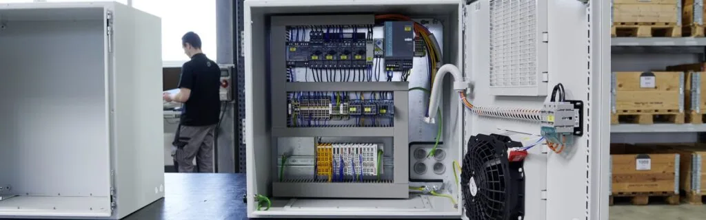 Rittal AX Enclosure open in a factory area.  Available from LED Controls