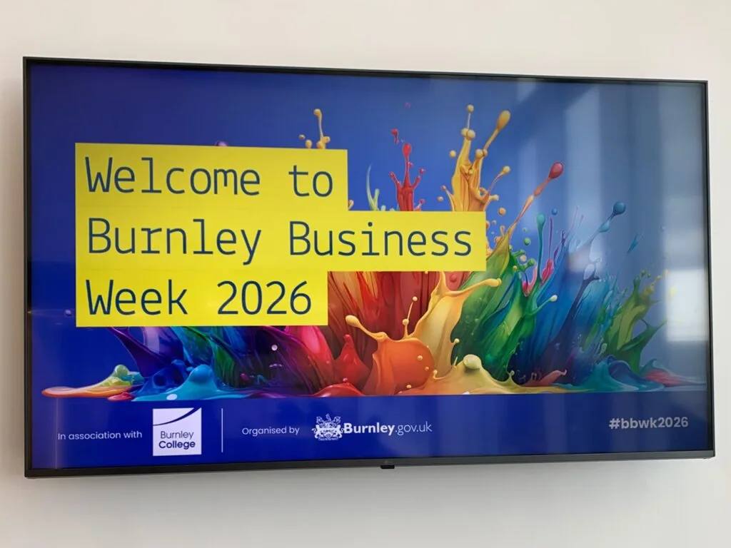 TV screen reads Welcome to Burnley Business Week 2026