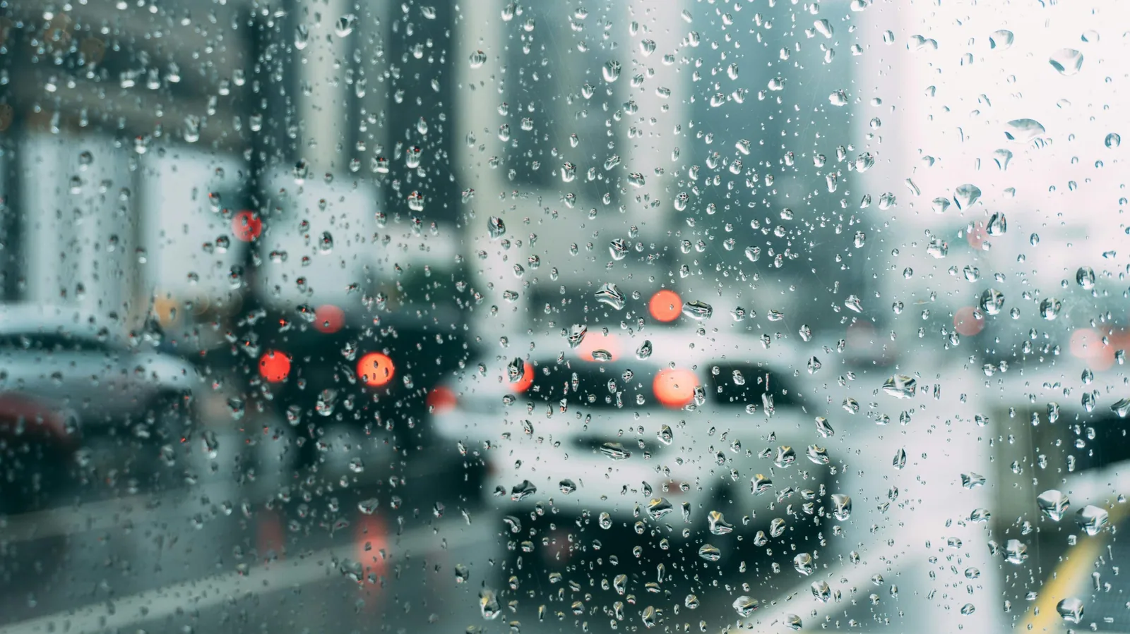 City streets viewed through rainy windows.